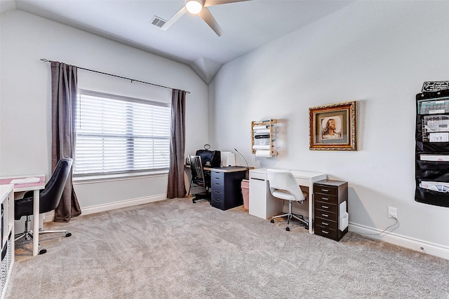 carpeted home office with vaulted ceiling and ceiling fan