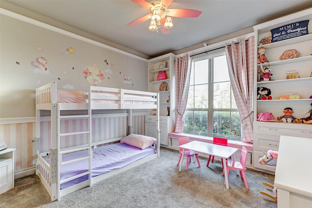 carpeted bedroom with ceiling fan and crown molding