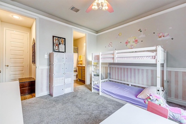 bedroom with light colored carpet, ceiling fan, and crown molding