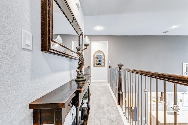 corridor featuring carpet flooring