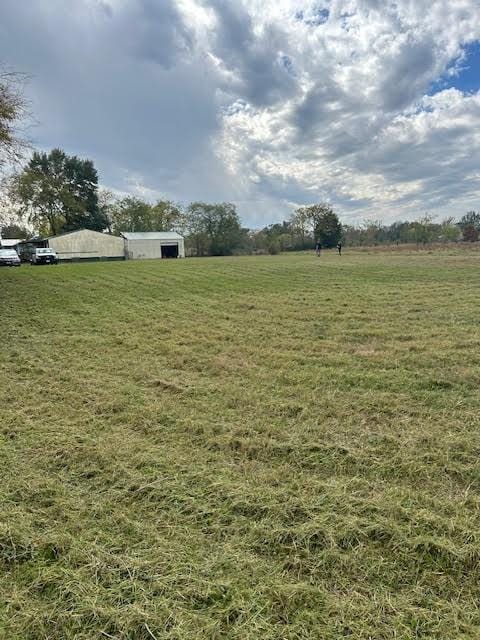 view of yard with a rural view