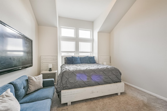 bedroom featuring light colored carpet