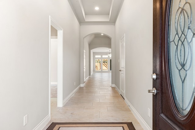 corridor with a tray ceiling