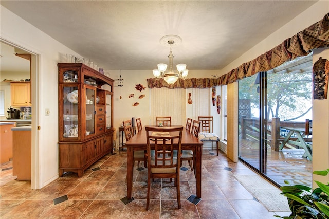 dining area with a notable chandelier