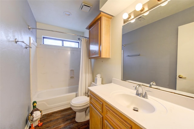 full bathroom with vanity, hardwood / wood-style flooring, toilet, and shower / bathtub combination with curtain