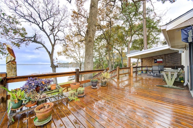 wooden deck featuring a water view