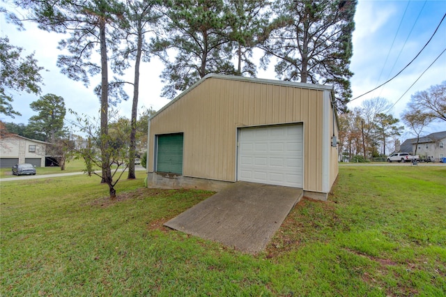 garage featuring a lawn