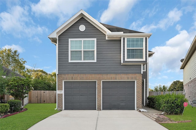 view of front facade featuring a garage and a front lawn