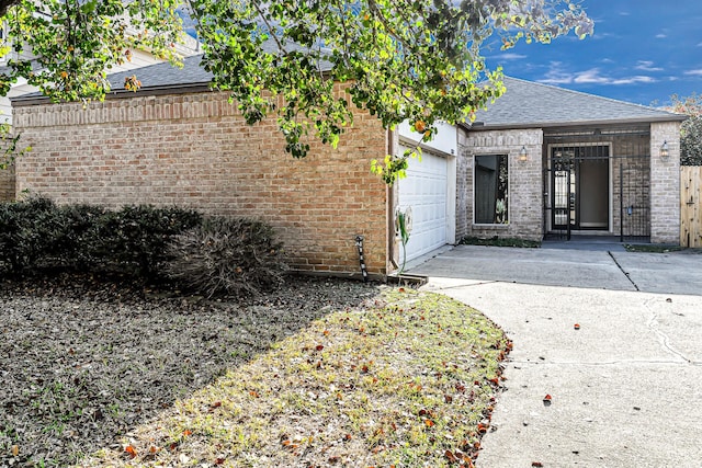 doorway to property featuring a garage