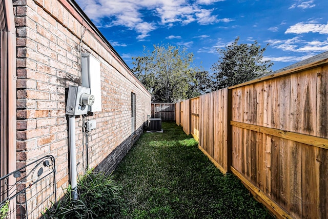 view of yard featuring central air condition unit