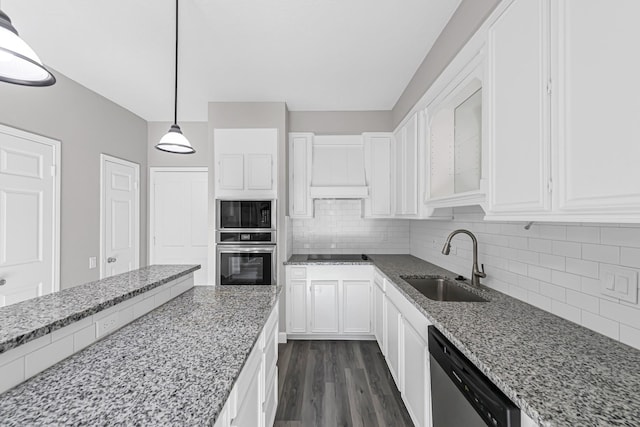 kitchen with sink, decorative light fixtures, light stone counters, white cabinetry, and stainless steel appliances