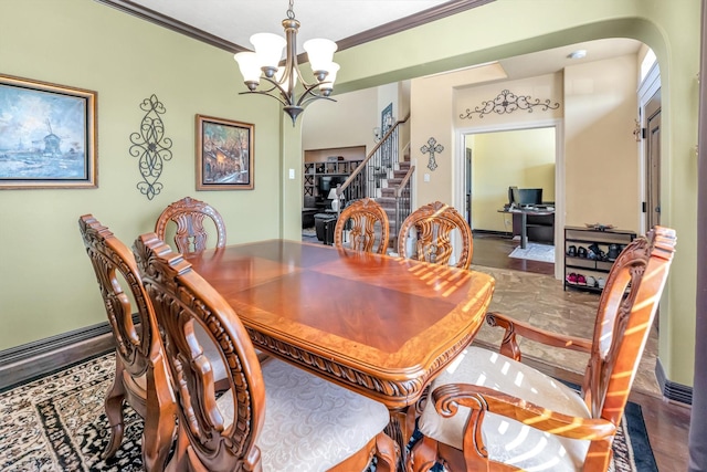 dining space featuring a notable chandelier and crown molding