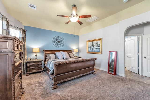 bedroom with ceiling fan and light carpet