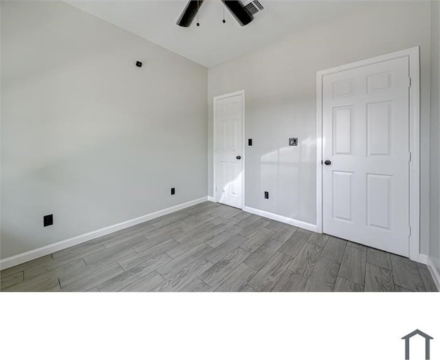 unfurnished room featuring ceiling fan and light hardwood / wood-style flooring