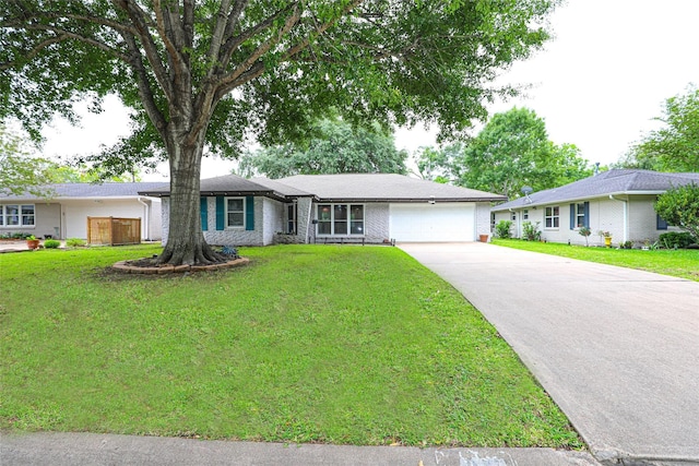 ranch-style home featuring a garage and a front lawn