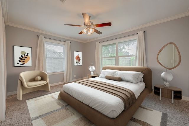 carpeted bedroom featuring multiple windows, ceiling fan, and ornamental molding