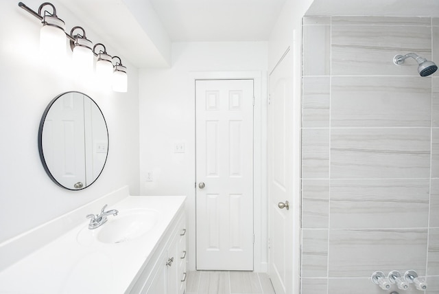 bathroom featuring vanity and walk in shower