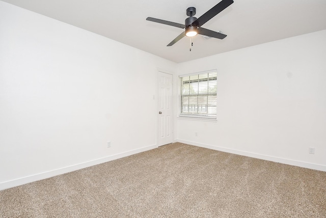 spare room with ceiling fan and carpet floors