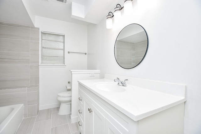 bathroom with tile patterned floors, vanity, and toilet