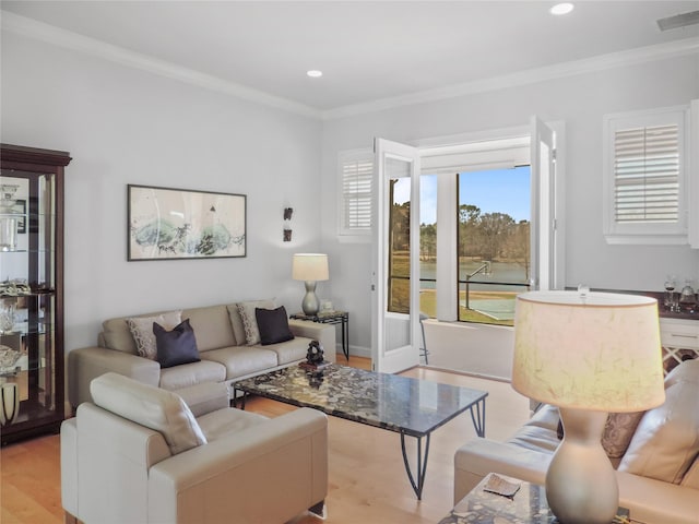 living room featuring crown molding and light wood-type flooring