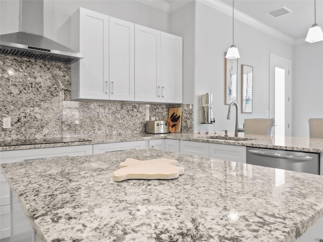 kitchen with stainless steel dishwasher, crown molding, sink, wall chimney range hood, and white cabinets