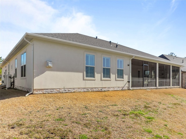 back of house with a sunroom