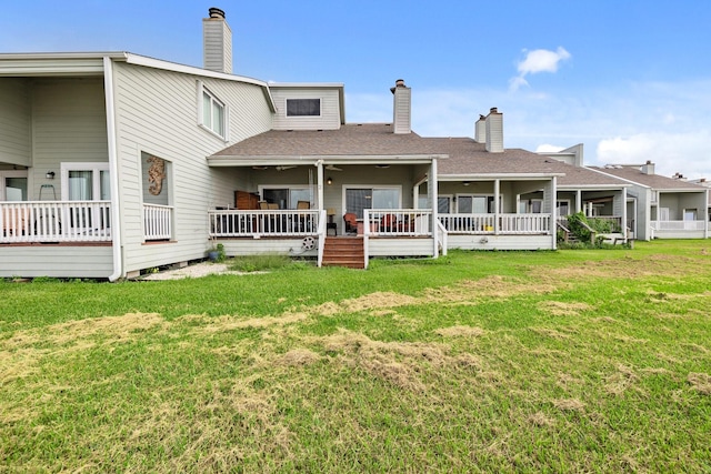 back of property featuring a yard and a porch