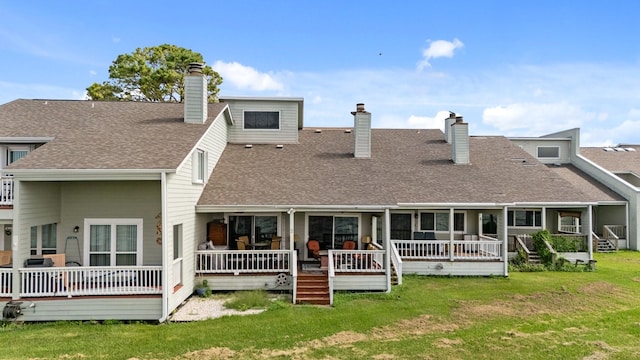 back of house featuring a lawn and a porch