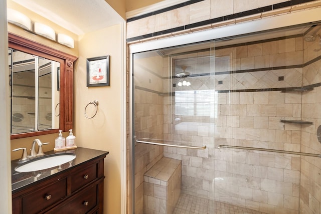 bathroom with vanity and a shower with shower door