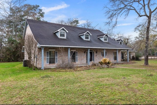 cape cod home with a front lawn