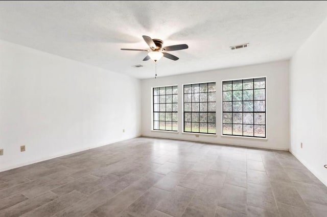 spare room with ceiling fan