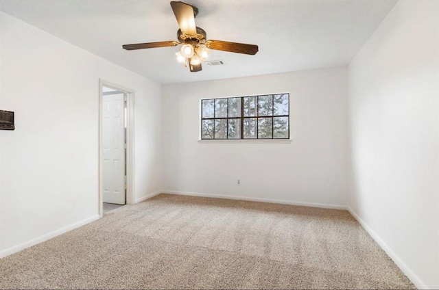 spare room with carpet flooring and ceiling fan