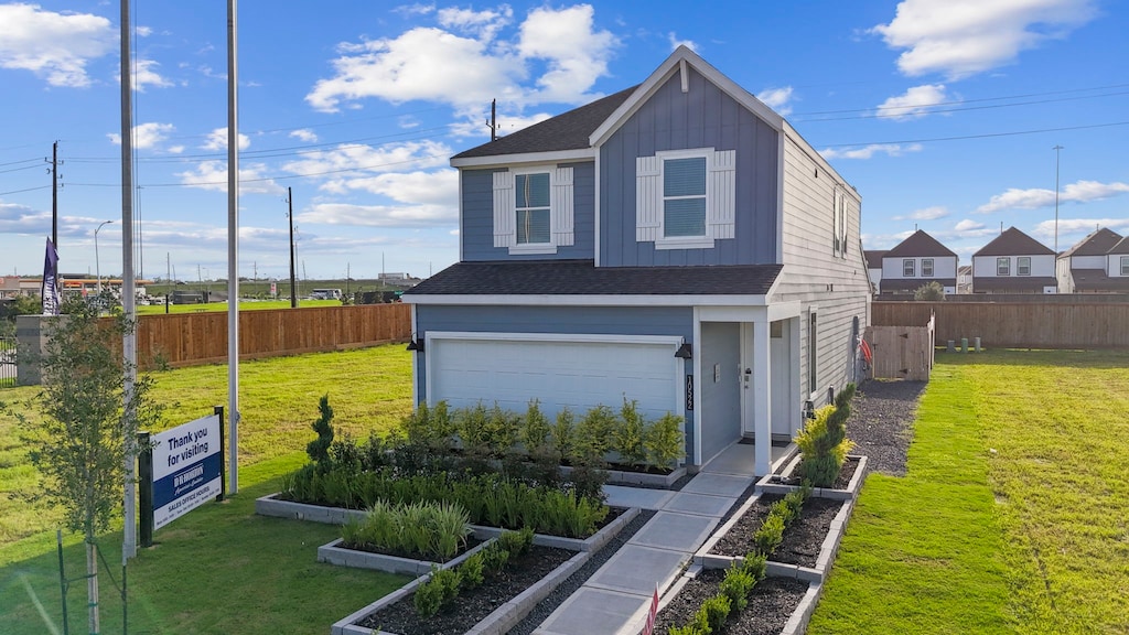 view of home's exterior with a lawn and a garage