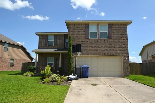 view of front property featuring a front yard and a garage