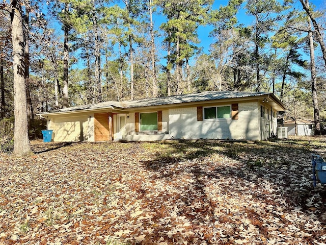 ranch-style house with central air condition unit