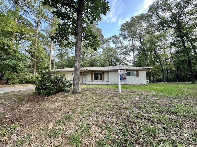 view of front of home with brick siding