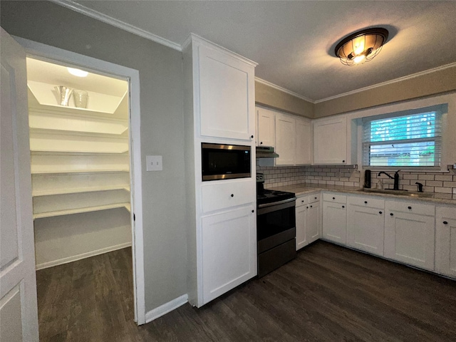 kitchen with dark wood-style flooring, range with electric cooktop, a sink, and tasteful backsplash