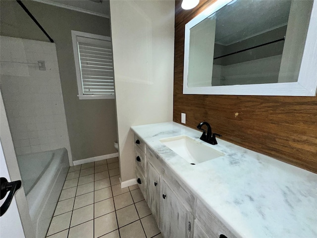 full bath featuring bathtub / shower combination, vanity, tile patterned floors, baseboards, and backsplash