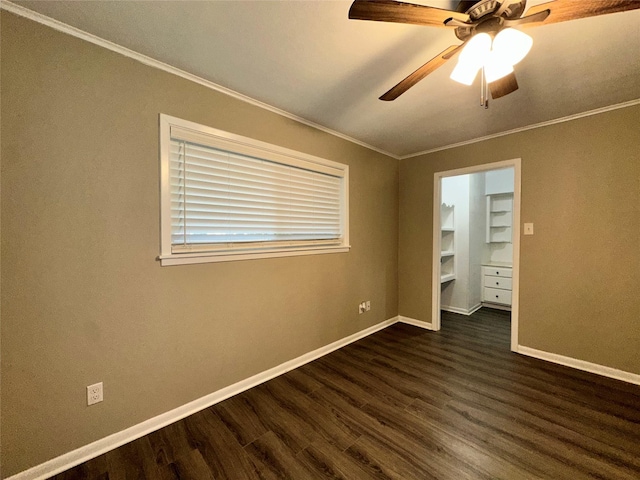 unfurnished bedroom with baseboards, ornamental molding, a ceiling fan, and dark wood-style floors