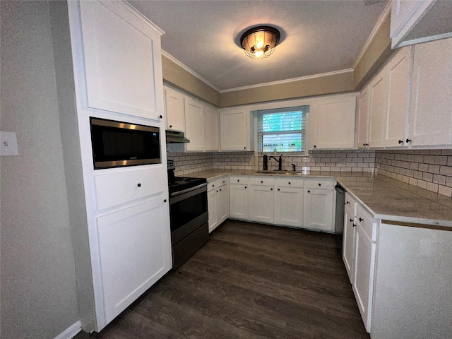 kitchen featuring electric range, crown molding, a sink, stainless steel microwave, and dark wood-type flooring