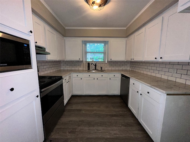 kitchen featuring ornamental molding, under cabinet range hood, white cabinets, and stainless steel appliances