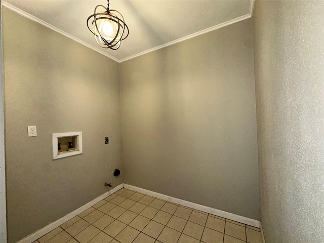 laundry area with crown molding, hookup for a washing machine, light tile patterned flooring, and laundry area