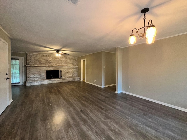 unfurnished living room featuring dark wood-style flooring, baseboards, ceiling fan with notable chandelier, and a fireplace