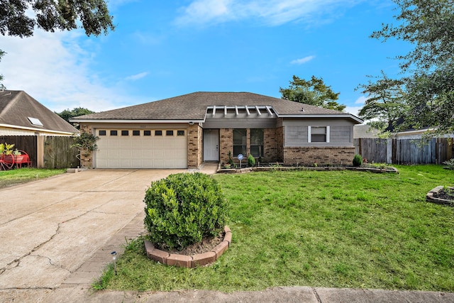 view of front of property featuring a garage and a front yard