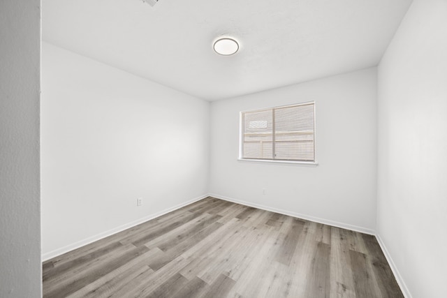 unfurnished room featuring light hardwood / wood-style floors