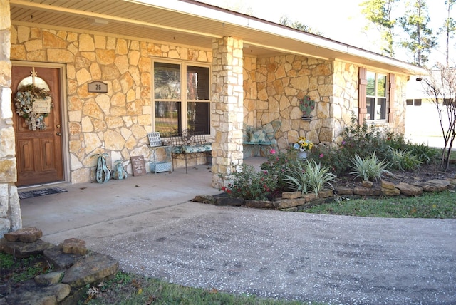26 Westpoint Dr, Trinity, TX 75862 - property entrance featuring stone siding and a porch