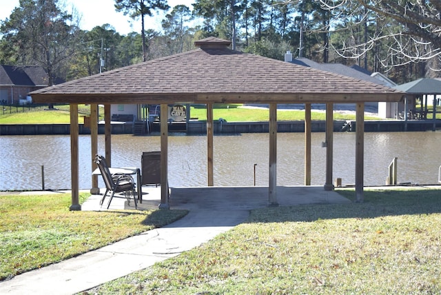 dock area featuring a yard and a water view