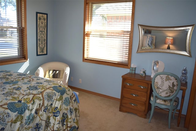 bedroom featuring light carpet