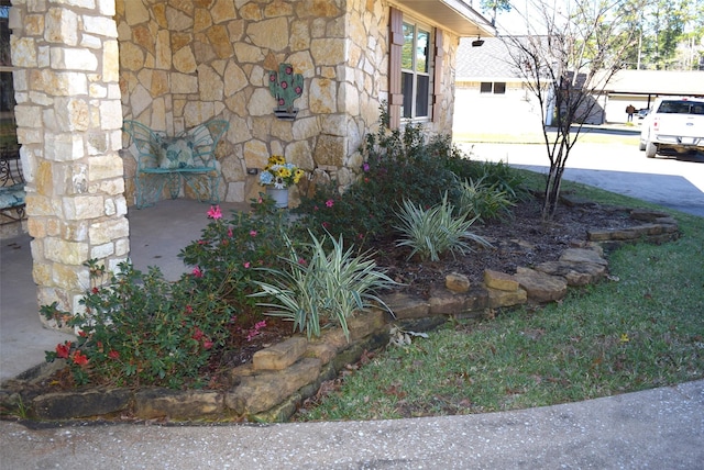 26 Westpoint Dr, Trinity, TX 75862 - view of side of home with stone siding and concrete driveway
