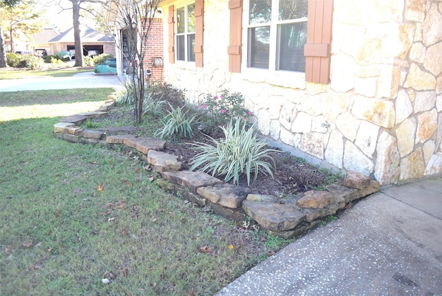 view of side of home featuring a yard